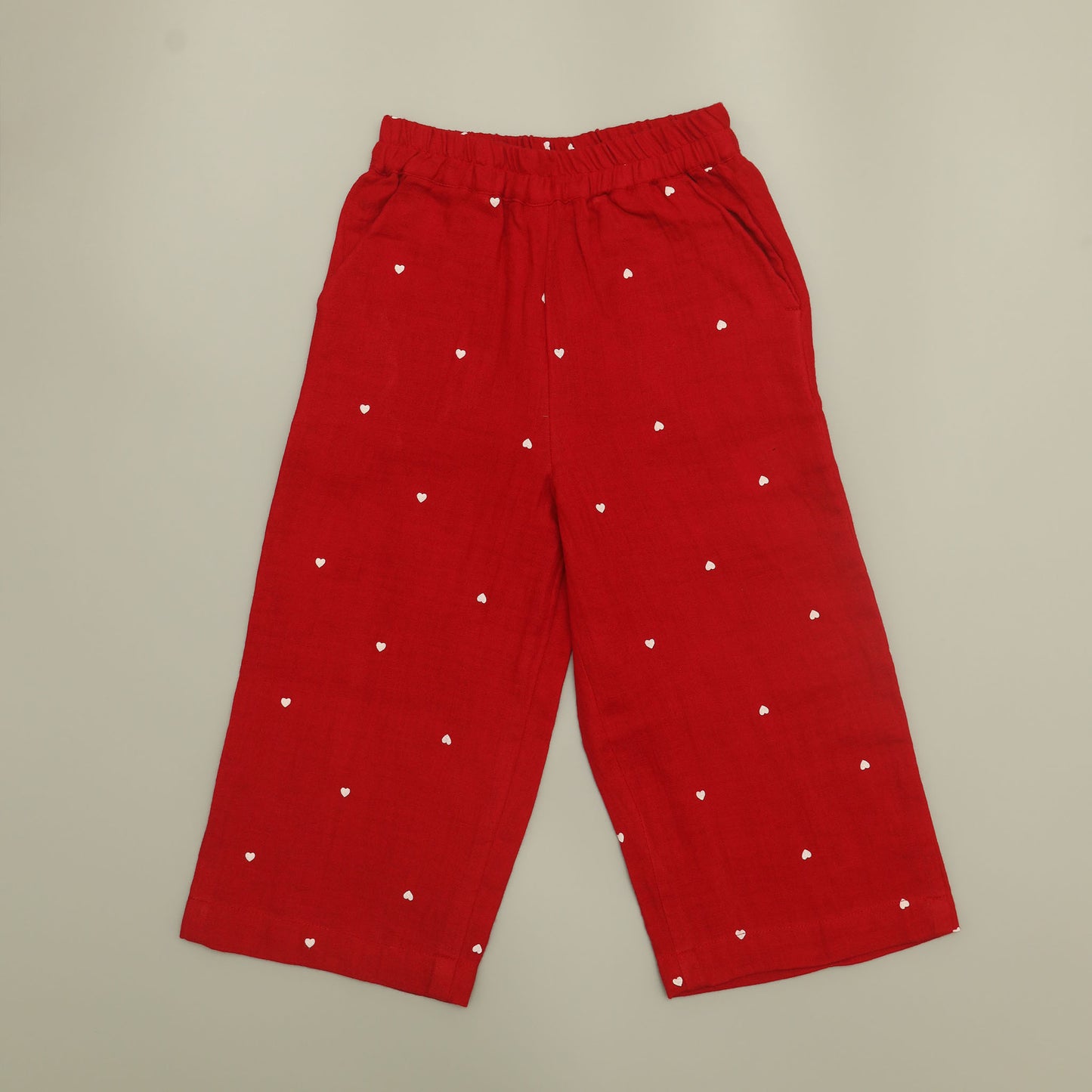 Red pants with white heart patterns