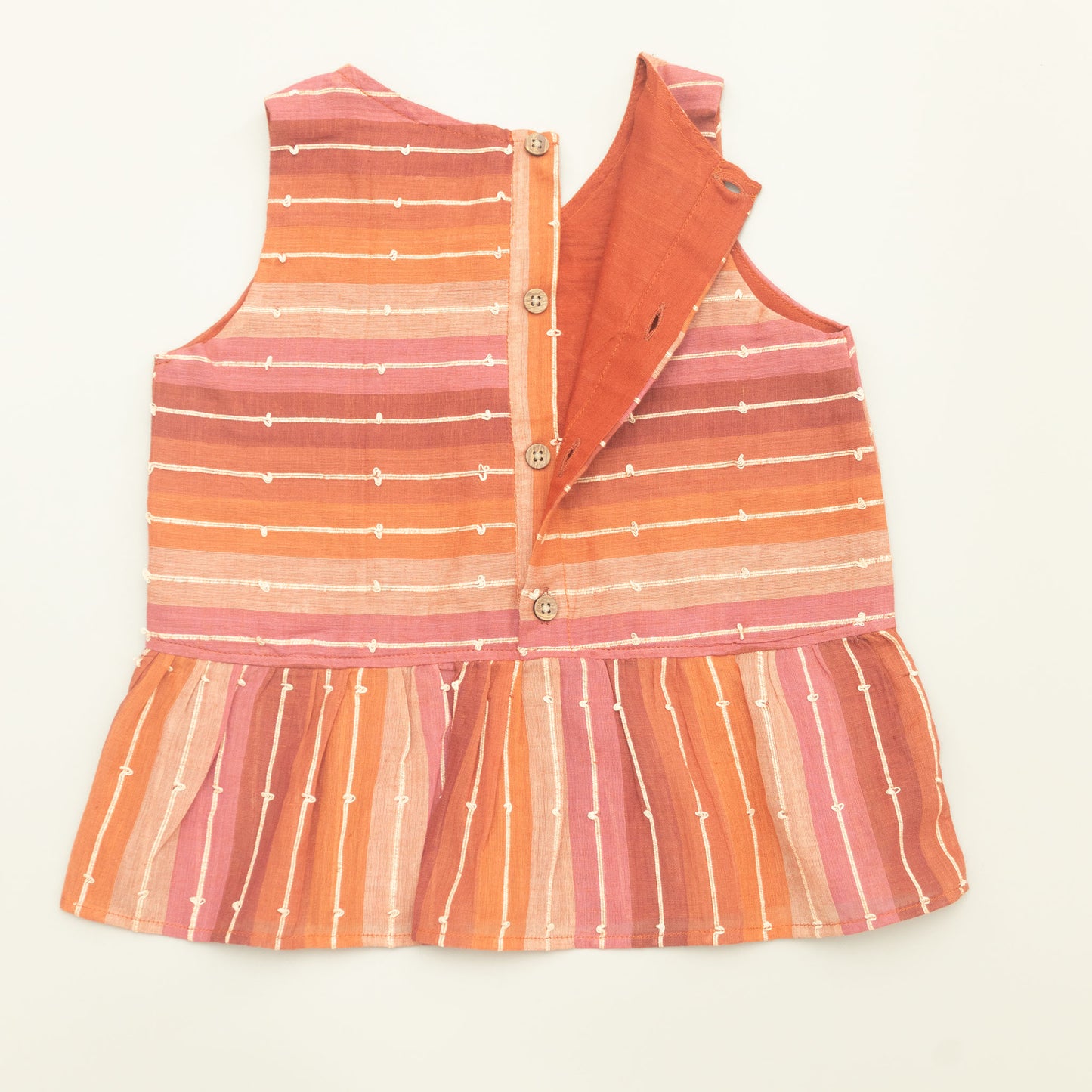 Striped dress with orange and pink gradient on a white background