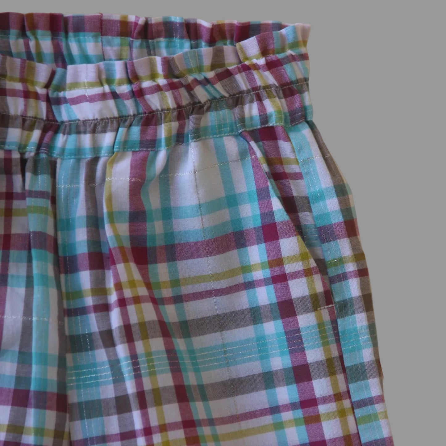Plaid pant on a beige background