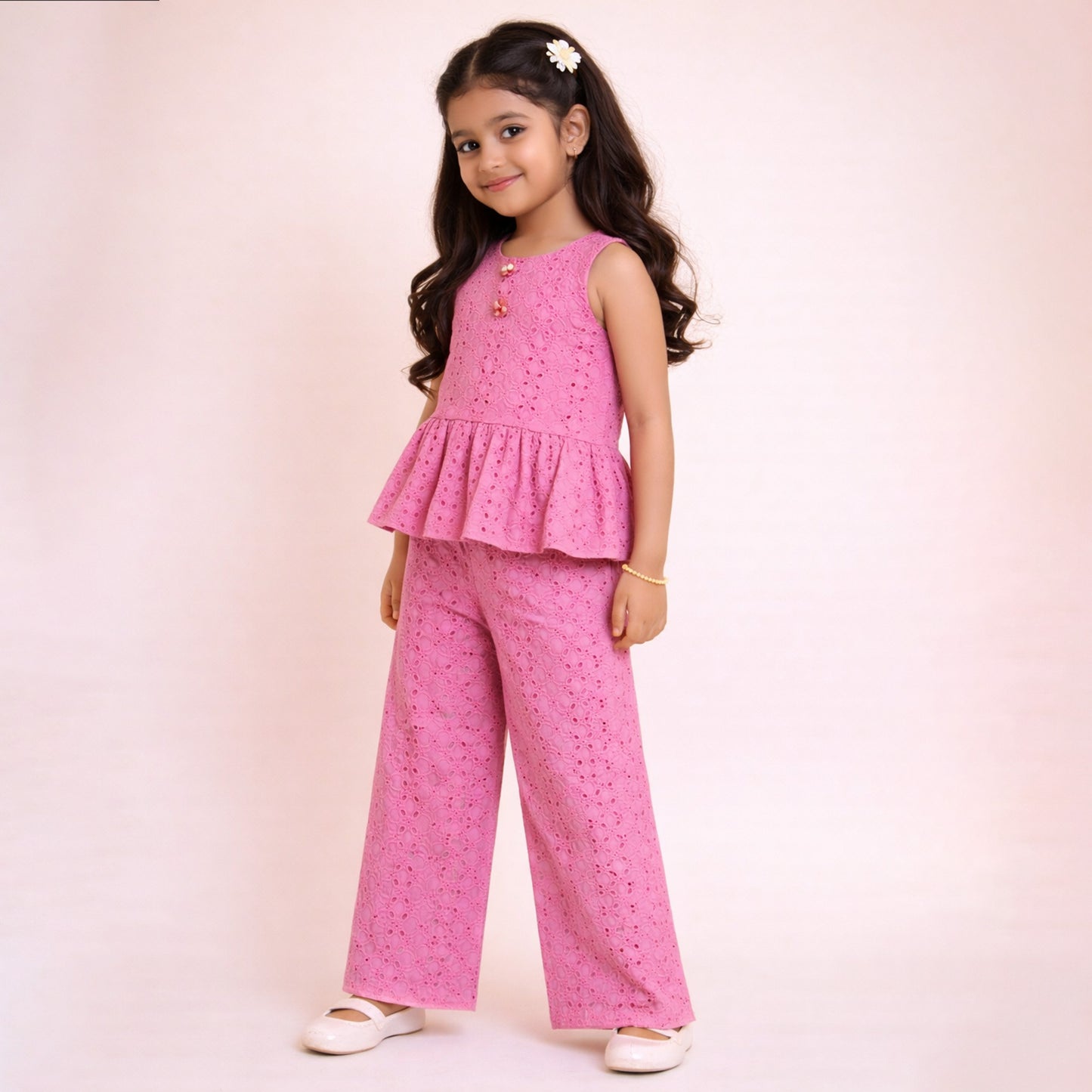 Girl wearing a pink hakoba sleeveless peplum top with matching straight pants