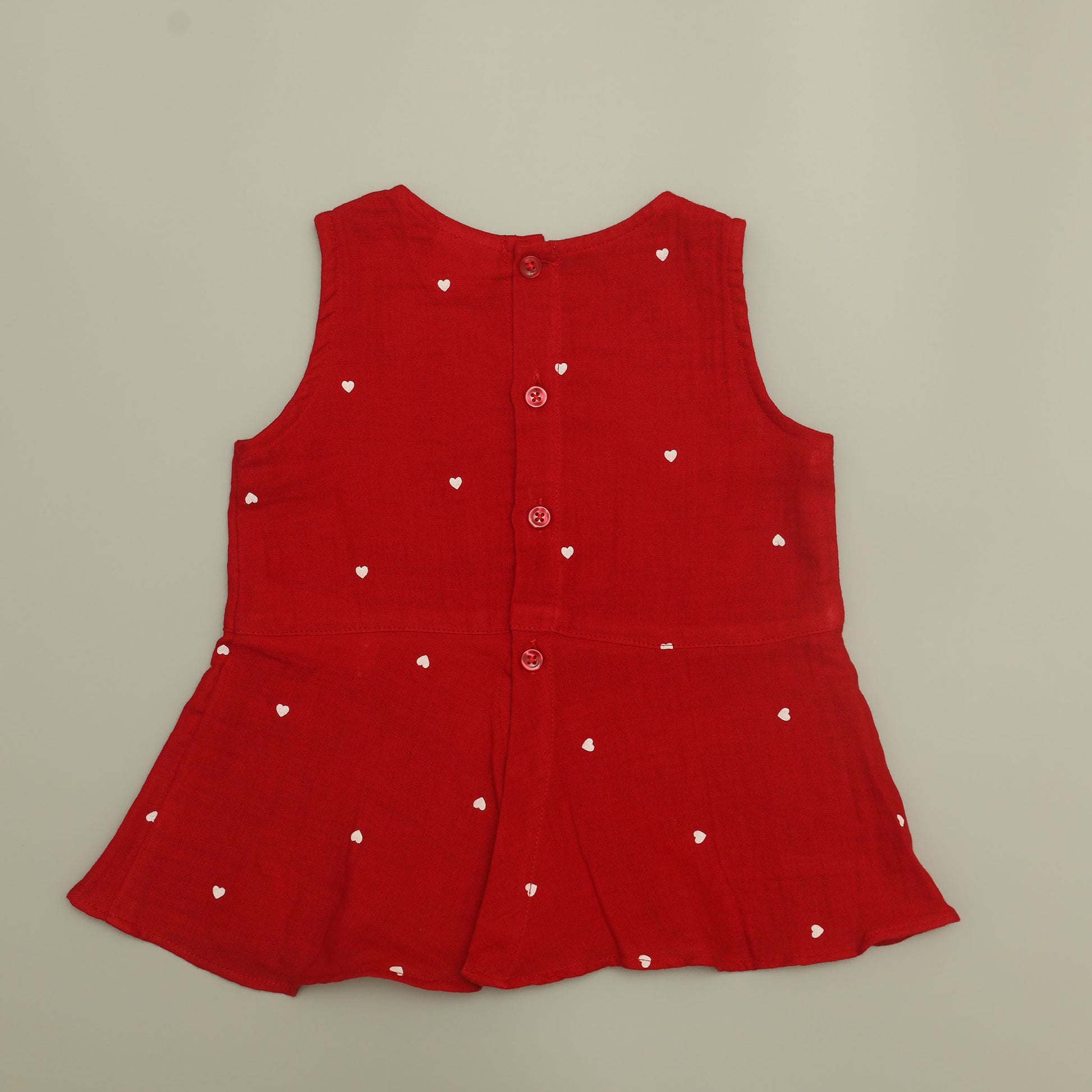 Red sleeveless dress with white heart patterns 