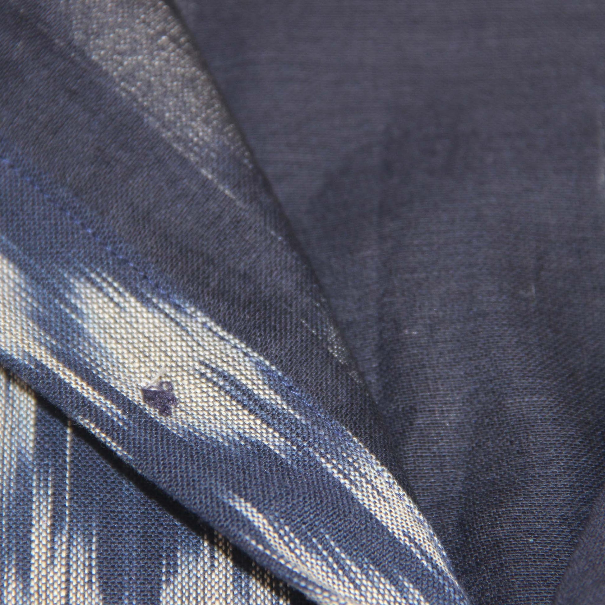 Close-up of blue ikat fabric with visible stitching