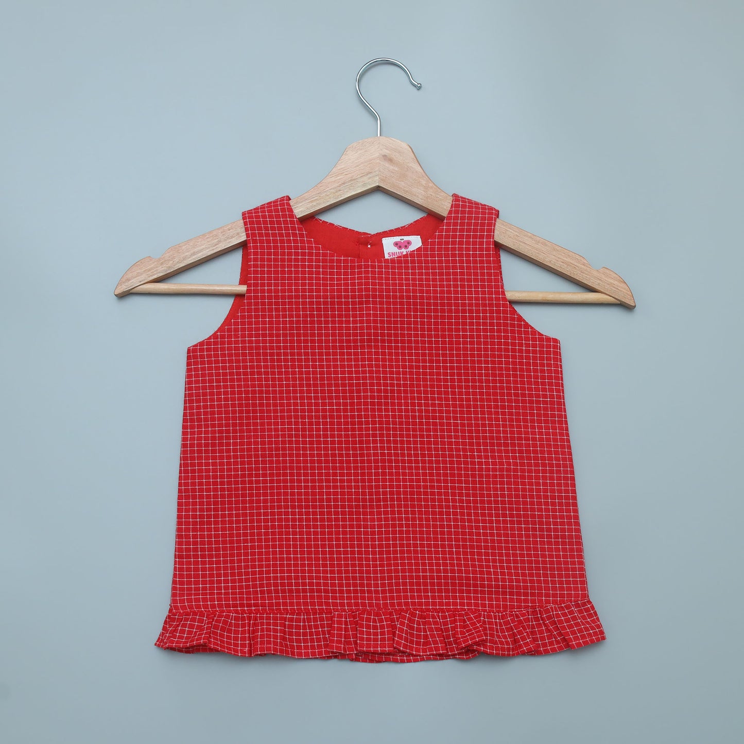 Snuk Kids girls' red checkered sleeveless top with frill hem.